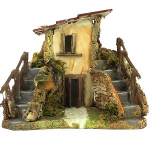 Maison rustique avec escalier pour la mise en place de la crèche