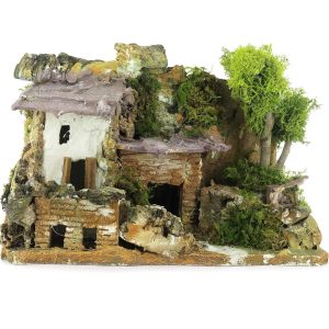 Casa de estuco con caseta de leña para belenes rústicos